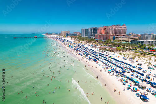 Panorama of Clearwater Beach FL. Florida Beaches. Summer vacations. Beautiful View on Hotels and Resorts on Island. Turquoise color of Ocean water. American Coast or shore Gulf of Mexico. Sunny Day