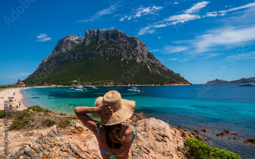 Woman enjoying the panorama of the protected marine area of the island of Tavolara, municipality of Olbia, Costa Smeralda - Sardinia photo
