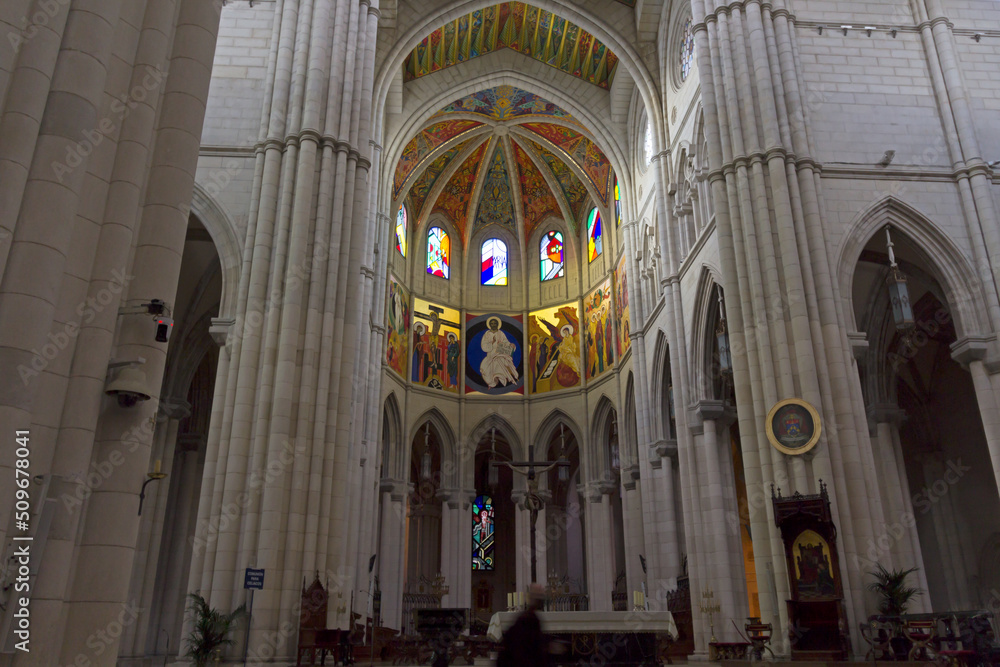 MADRID, SPAIN - Apr, 12, 2022: Beautifully lit of Santa Maria la Real de La Almudena Cathedral. Colourful decorated ceilings. Madrid is a popular tourist destination of Europe.