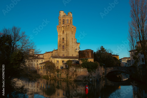 Historic center of the city of Padua. The Specola seen from the canal. Particular warm light, artistic image. photo