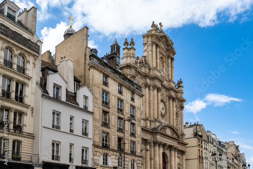 Paris, typical buildings in the Marais, rue Saint-Antoine, with the Saint-Paul church 