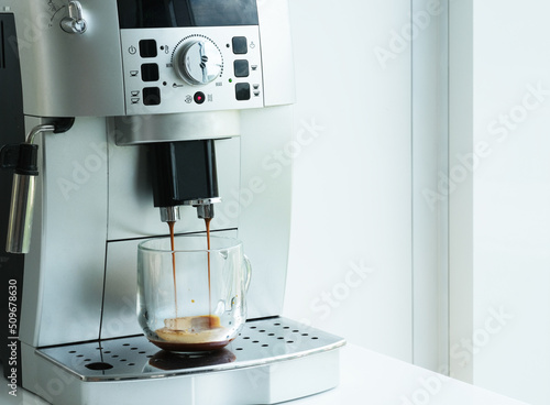 Картината върху платно transparent coffee cup with silver coffee machine