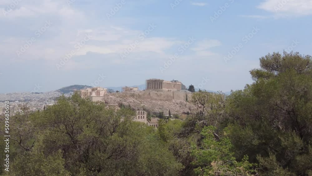 View of the Acropolis of Athens between olive trees View of the Acropolis of Athens between olive trees