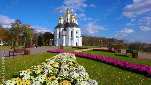 Colorful flower beds in front of St Catherine's Church in Chernihiv, Ukraine photo