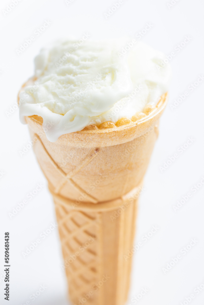 ice cream cone on white background and sugar particles on it ice cream cone on white background and sugar particles on it