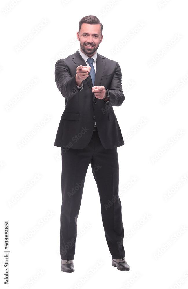 full length .smiling handsome businessman pointing at you full length .smiling handsome businessman pointing at you