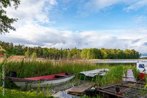 Fototapeta Naklejka Na Ścianę i Meble -  Rowing boats floating over the Lake Selment Wielki waters. Masuria, Mazury Lake District, Poland