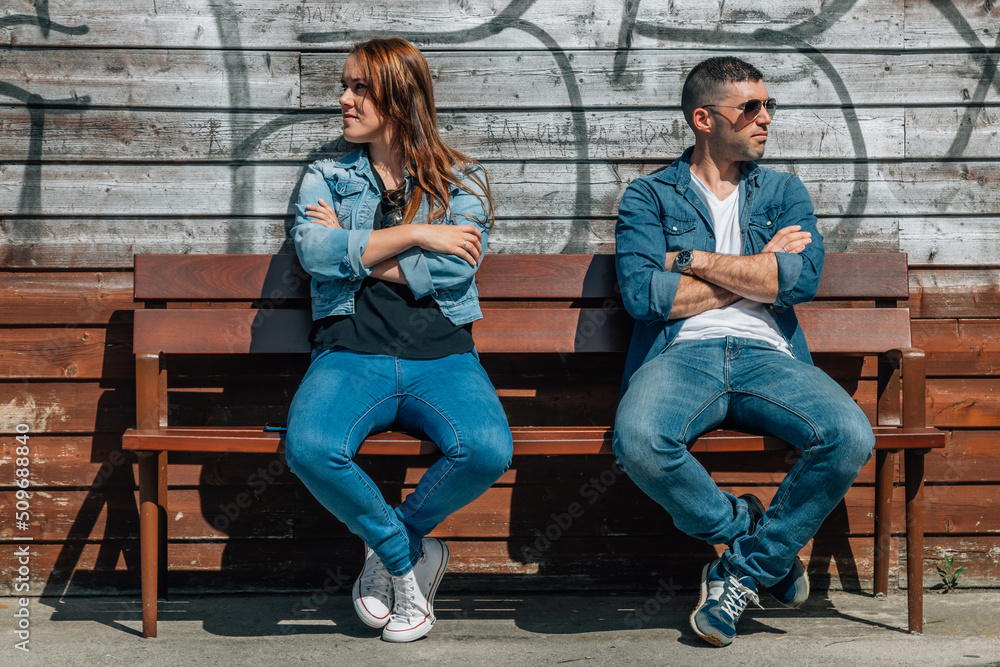 angry couple sitting on the bench angry couple sitting on the bench