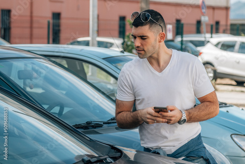 man buying used or second-hand car at dealership
