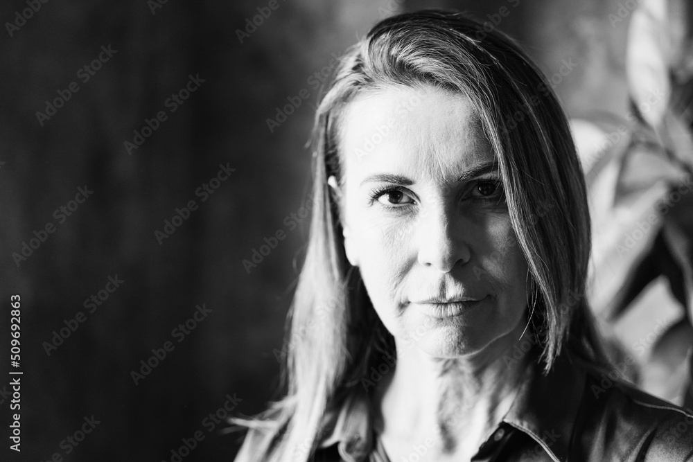 Senior business woman looking at camera - Focus on face - Black and white editing