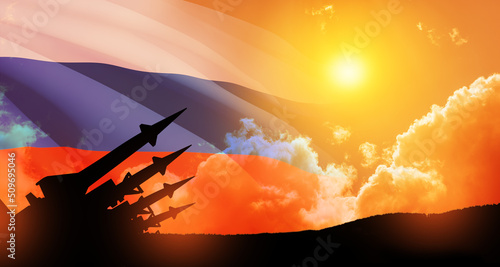Canvas Print The missiles are aimed at the sky at sunset with Russian flag