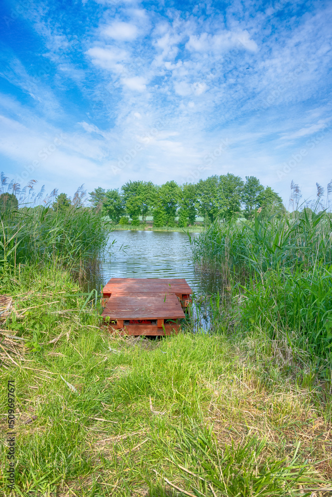 Perfect lake in the summer season with cloudy sky Perfect lake in the summer season with cloudy sky