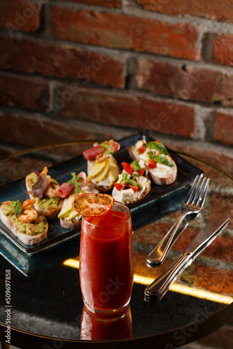 Obraz na płótnie Bruschettas with vegetables. Start dishes with cherry tomatoes, avocado, cream cheese and shrimps. Food composition, tasty italian meal w salonie