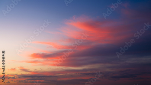 Sky with clouds during sunset. Pink clouds and blue sky. A high-resolution photograph. Panoramic photo for design and background. © biletskiyevgeniy.com