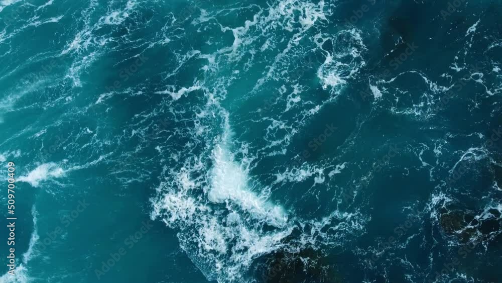 Pure blue Ocean water waves with light reflections at Slow motion, Powerful storm on the sea