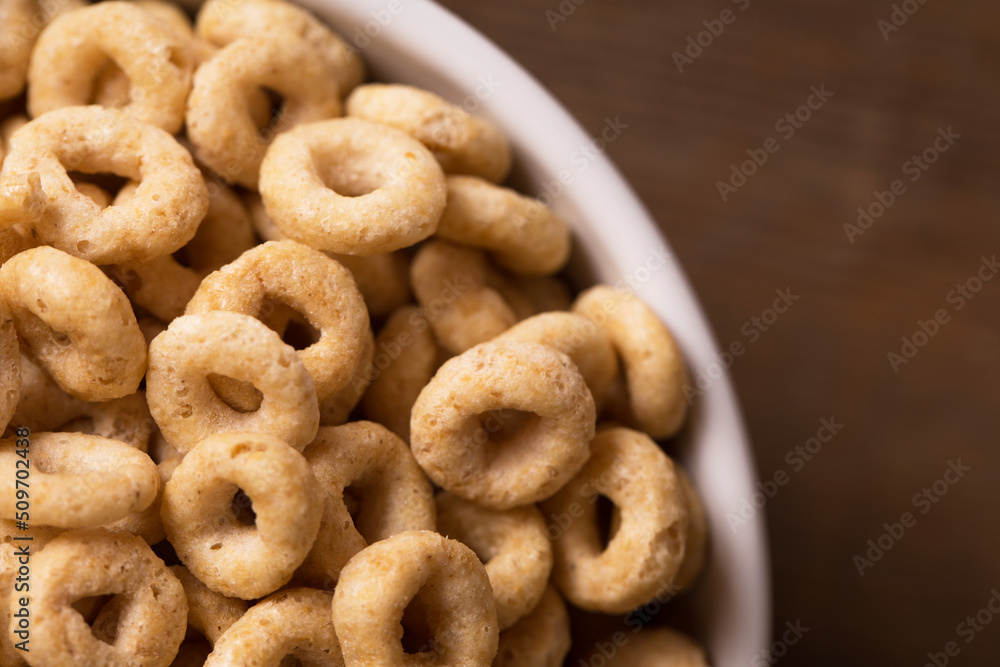Cereal on Wood Surface in White Bowl Cereal on Wood Surface in White Bowl