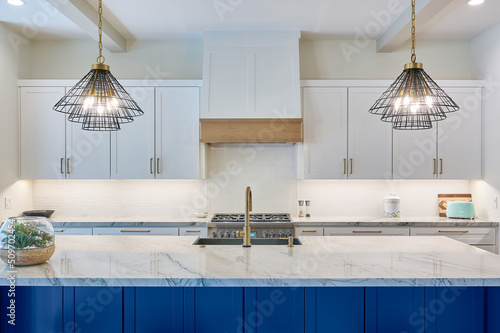 Photography Contemporary kitchen counters and cabinets with island