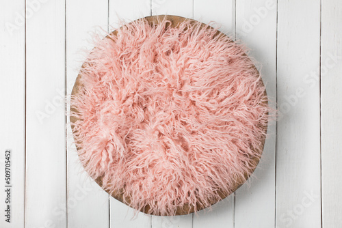 Newborn Digital Background Pink Fur in a Basket on a White Background  photo