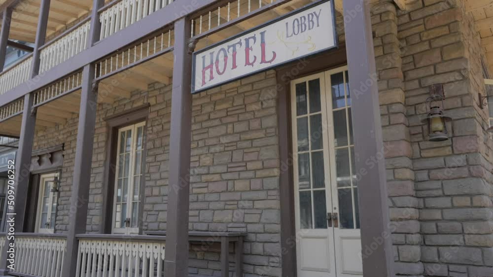 This panning video shows an old western hotel front facade building. This panning video shows an old western hotel front facade building.