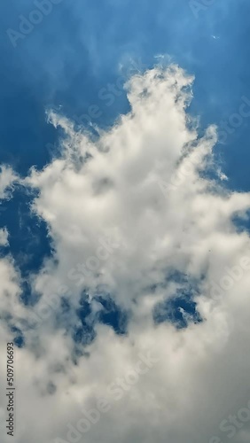 Blue sky with beautiful fluffy clouds time lapse photo