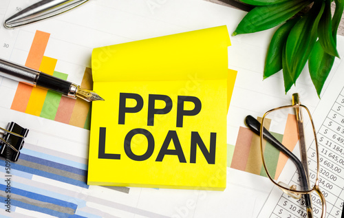 yellow sticker with the text ppp loan and charts