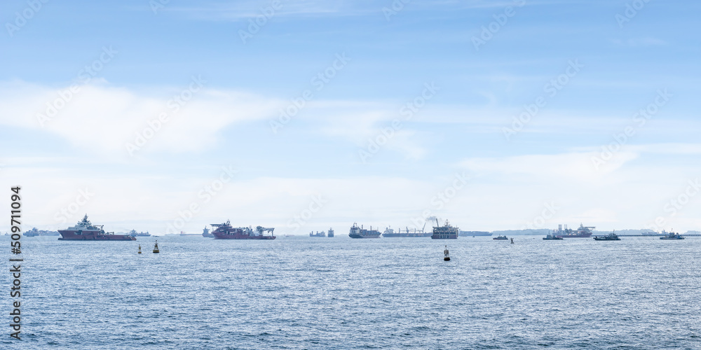 sea at Singaport strait with many container ship and cargo vessels