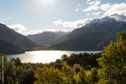 Obraz na płótnie Lake between mountains of the Andes mountain range and a rustic house on its coast. Los Alerces National Park w salonie