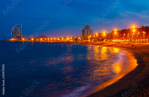 Evening view of the beach of Barceloneta - a lively quarter of the Old City of Barcelona, popular with locals and tourists © JackF