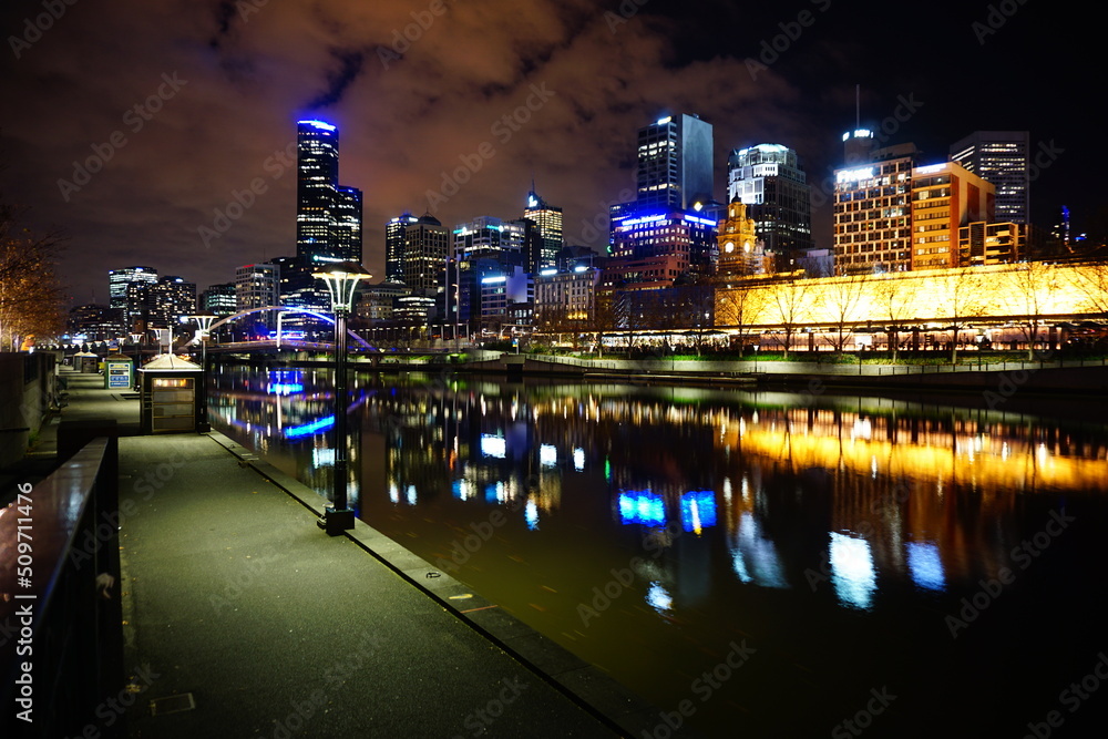 City Night Scene with River and Bridge