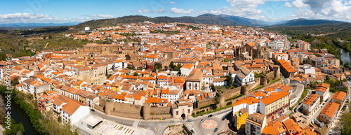 Scenic panoramic view from drone of ancient walled Spanish city of Plasencia on bank  photo