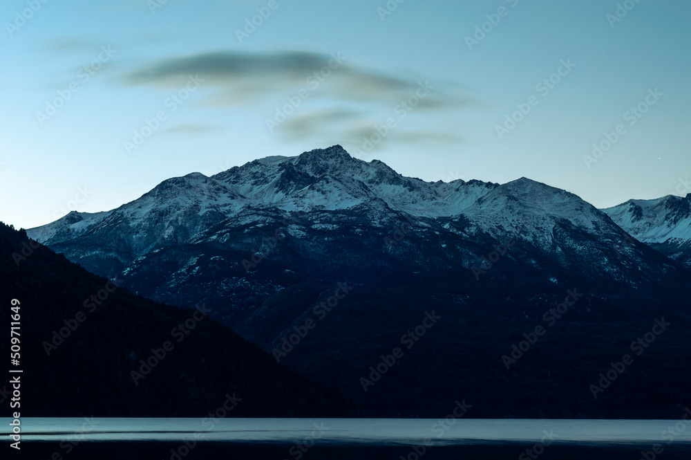 Snowy Andes mountain range hills during a sunrise. Los Alerces National Park