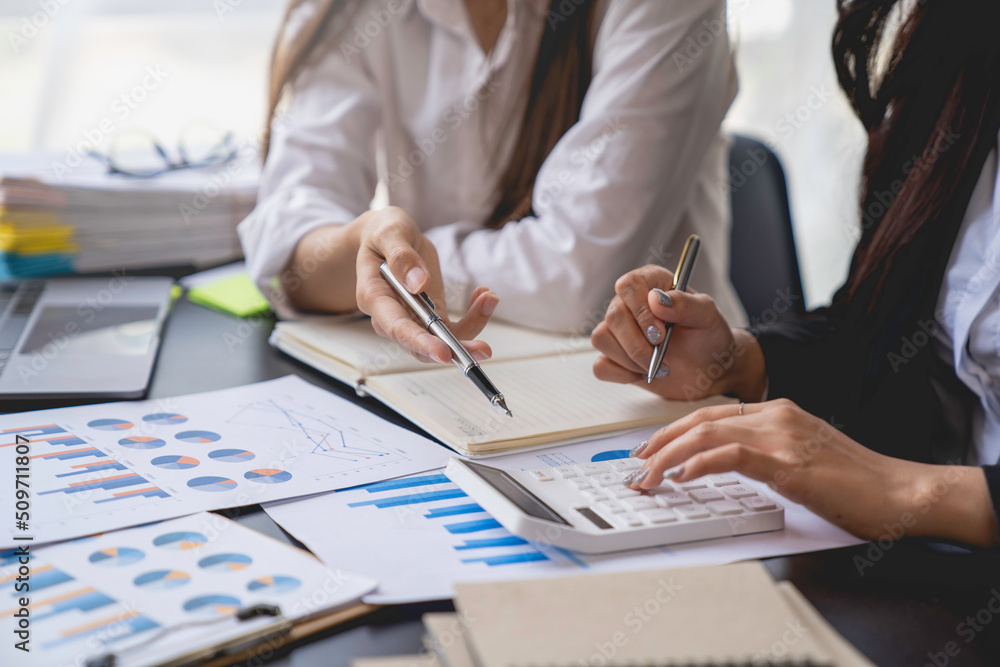 Financial analyst analysis business financial report on the document during a discussion at meeting of corporate showing the results of their successful teamwork, business meeting concept, Marketing Financial analyst analysis business financial report on the document during a discussion at meeting of corporate showing the results of their successful teamwork, business meeting concept, Marketing