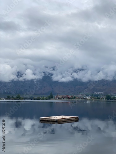 Dock in the middle of Osoyoos lake during a cloudy/stormy day (portrait)