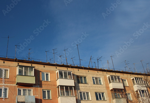 homemade metal antennas receive a radio signal for television providers on the roof of the house