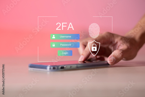 Businessman touching smartphone and using virtual screen for two-factor authentication for safety use of social networks and access to information privacy
