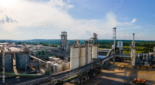 Aerial view of oil and gas refining petrochemical factory with tall refinery plant manufacture structure © bilanol