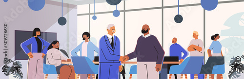 businesspeople shaking hands with each other handshake successful deal agreement partnership cooperation teamwork