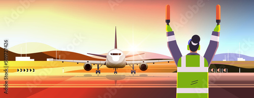 aviation marshaller supervisor in uniform navigate with light sticks air traffic controller airline worker in signal vest