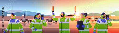 aviation marshallers supervisors team in uniform air traffic controllers airline worker in signal vests professional airport staff