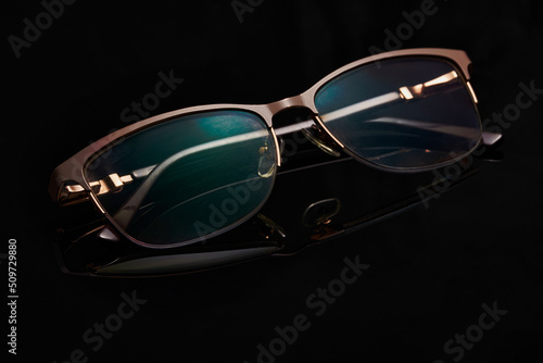 Glasses in fashionable frames on a black background