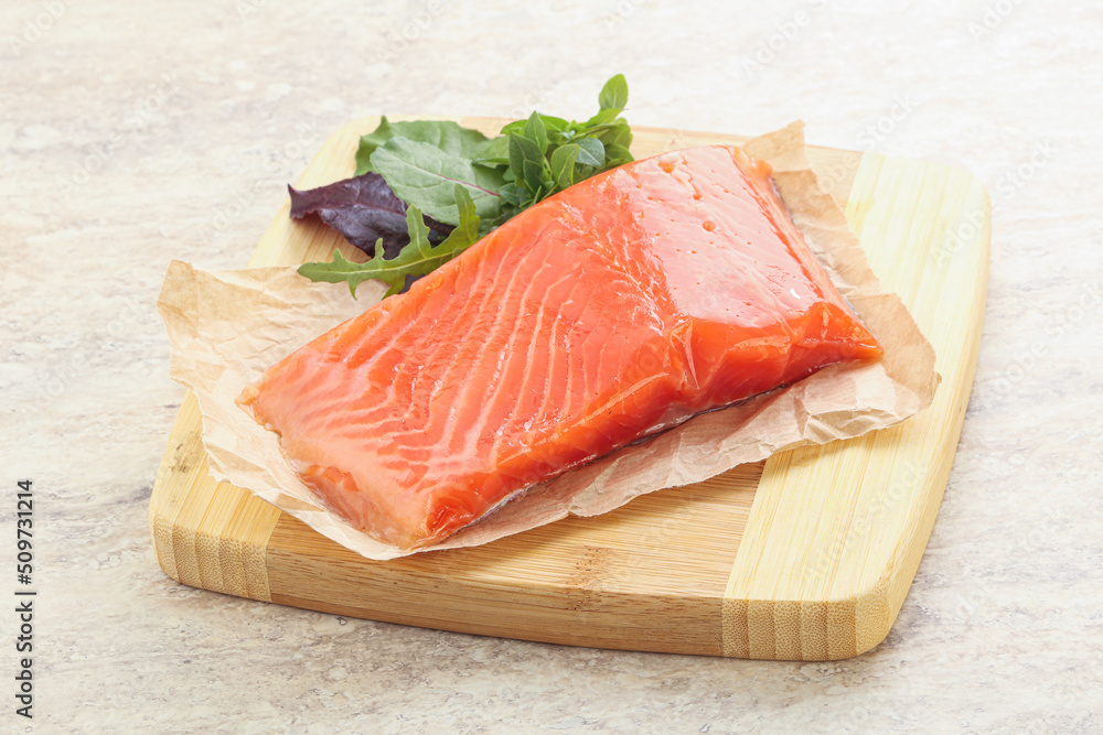 Raw salmon fillet over board Raw salmon fillet over board