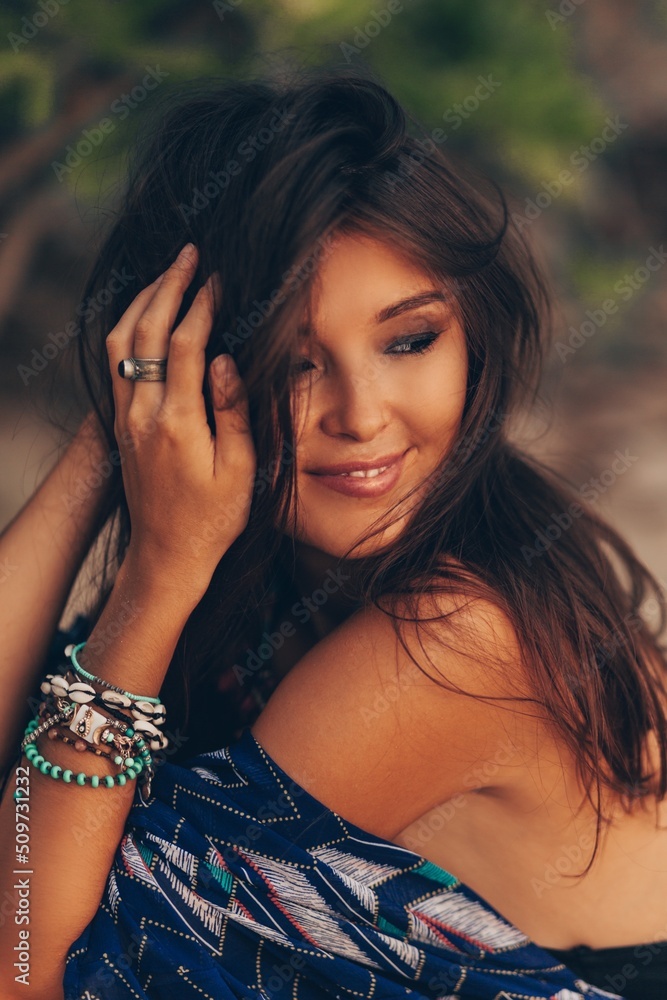 Close up portrait of beautiful asian woman in tropical outfit posing on the beach. Close up portrait of beautiful asian woman in tropical outfit posing on the beach.