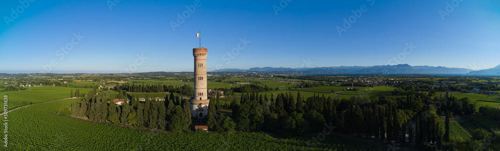 Aerial panorama of Tower of San Martino della Battaglia, italy. Aerial view of the tower on Lake Garda. Tower surrounded by vineyards drone view.