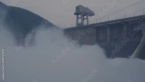Hydroelectric dam top view. Discharge of water at hydroelectric power plants. Big waterfall. Electricity. Krasnoyarsk hydroelectric power station. Yenisei river.