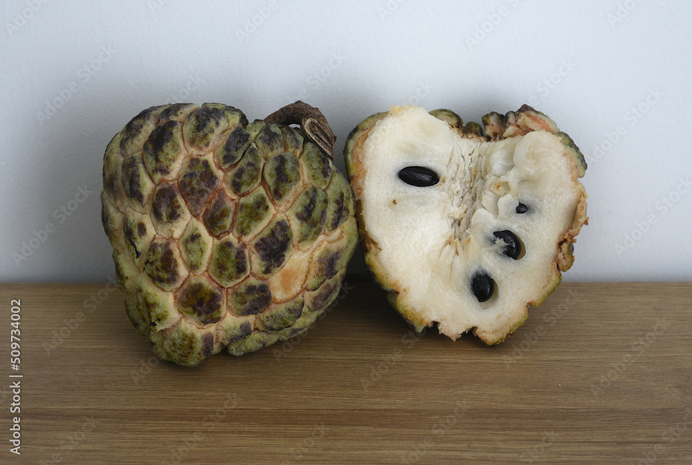 Ripe noina fruit or Custard apple also known as sugar apple on a table Stock Photo Adobe Stock Ripe noina fruit or Custard apple also known as sugar apple on a table Stock Photo Adobe Stock