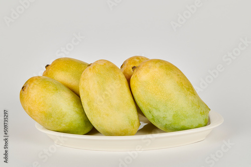 Plate of Kesar Mangoes on a white background