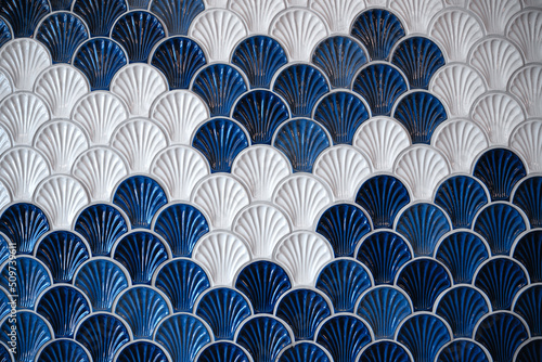 background of ceramic tiles in shell shape in blue and white