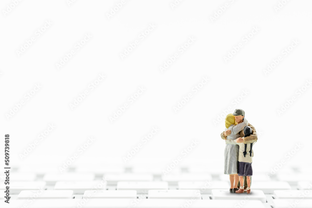 Family issues, teenager prolems and cyberbullying concept : Parents, father, mother, daughter hug all together on a keyboard, depicting the effects and impact of social media addiction in a family. Family issues, teenager prolems and cyberbullying concept : Parents, father, mother, daughter hug all together on a keyboard, depicting the effects and impact of social media addiction in a family.
