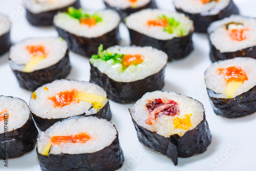 japanese sushi food - Maki ands rolls with tuna, salmon, shrimp, crab and avocado - Top view of assorted sushi - Rainbow sushi roll, uramaki, hosomaki and nigiri.