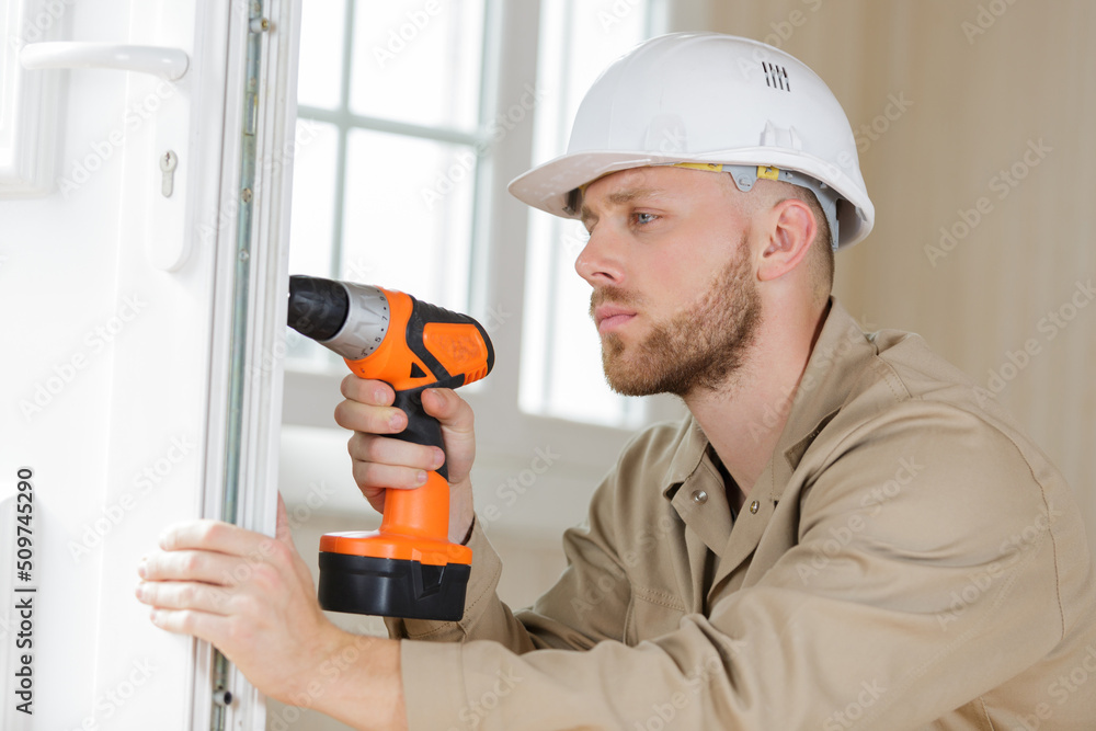 man holding a rotary drill man holding a rotary drill